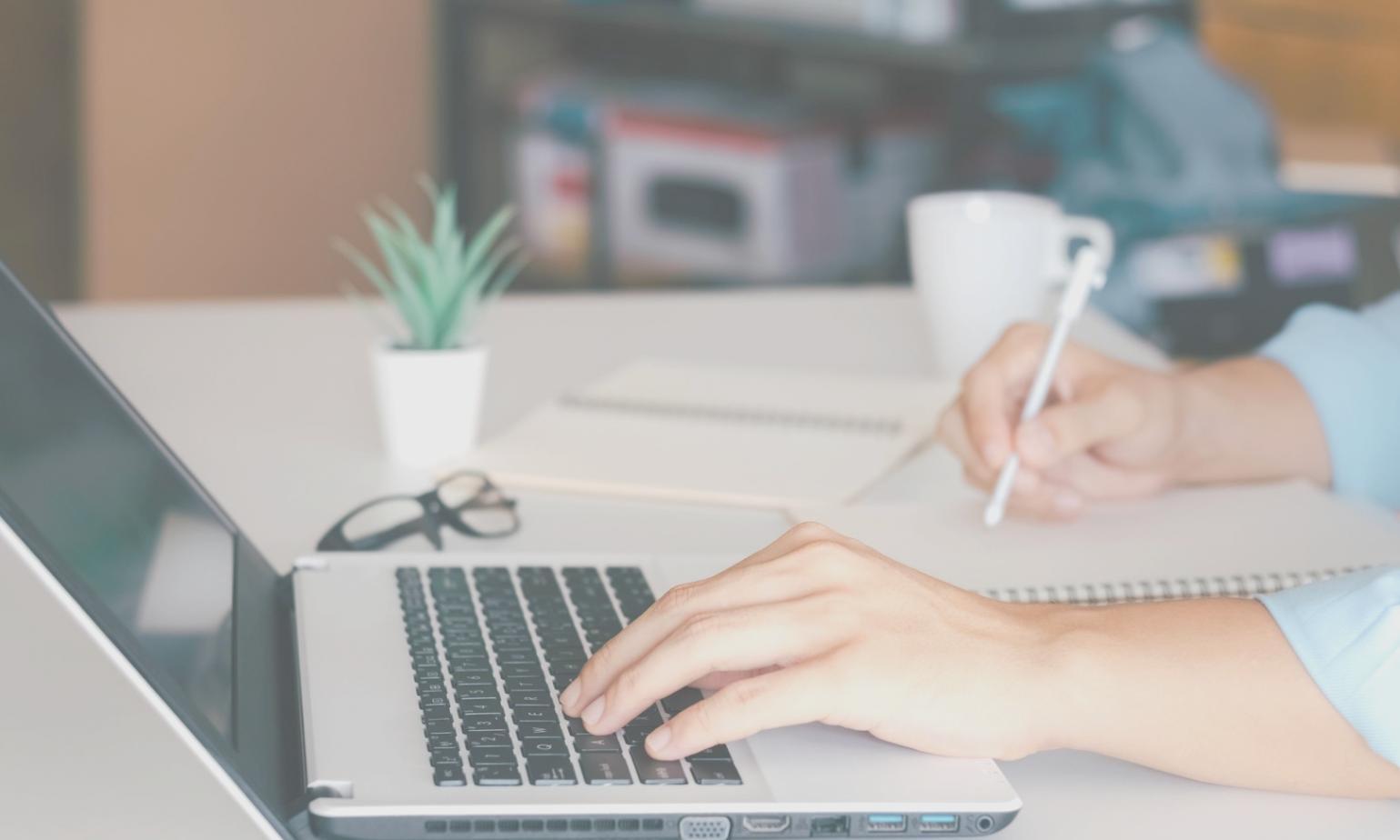 Professional workspace showing organized financial compliance documentation